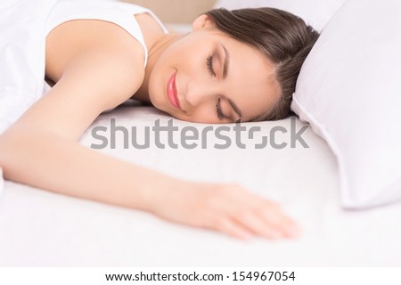 Woman sleeping. Beautiful young woman sleeping on the sofa