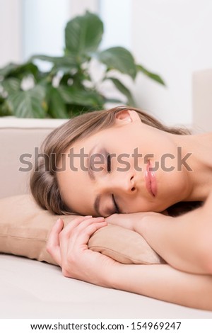 Woman sleeping. Attractive young women sleeping on the sofa