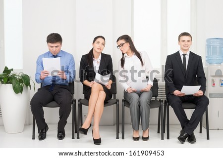 Four different people waiting for interview. Looking nervous