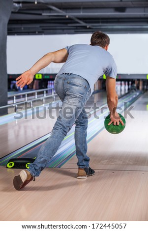 Bowling. Bowler attempts to take out remaining pins