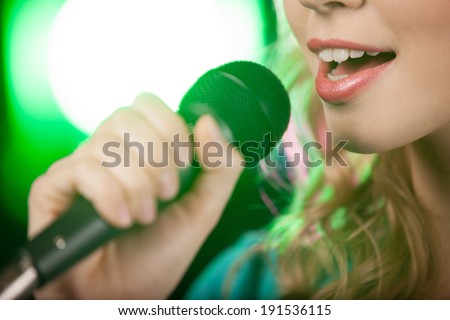 Singing Girl. Blond karaoke girl singing