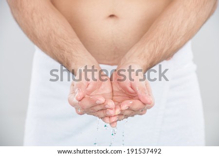 Washing hand. Close up image of man washing hand in bathroom