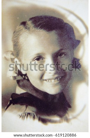 USSR, LENINGRAD - CIRCA 1941: Vintage photo of little smiling girl Valya Tikhonova from Leningrad, USSR. Girl portrait smile Stok fotoğraf © 