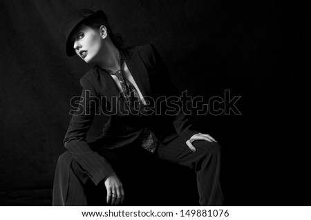 Androgynous woman wearing a suit and tie