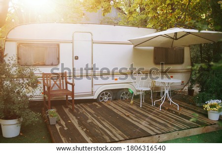 Similar – Image, Stock Photo A old camper with a fancy curtain