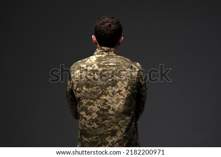 Similar – Image, Stock Photo Ukrainian man warrior dressed in a military pixel uniform stands on a white isolated background