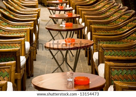 empty street cafe in zagreb croatia with rattan furniture