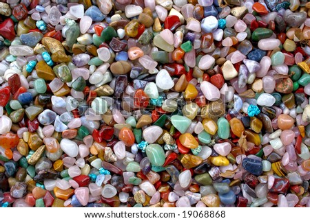 natural background - shiny multi coloured semi precious gem stones (for design, craftsmanship, gift)
