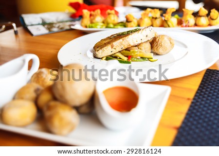 food on white plates, sea potatoes and tuna