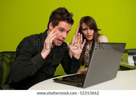 Big problems for woman and man working on laptop computer
