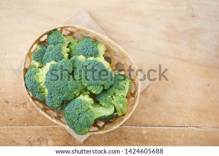   Ripe Broccoli Cabbage Isolated on Wood  Background
                              Photo stock © 