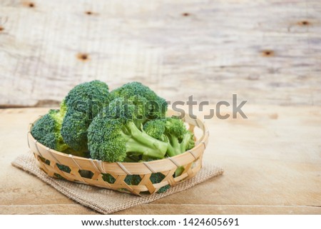   Ripe Broccoli Cabbage Isolated on Wood  Background
                              Photo stock © 