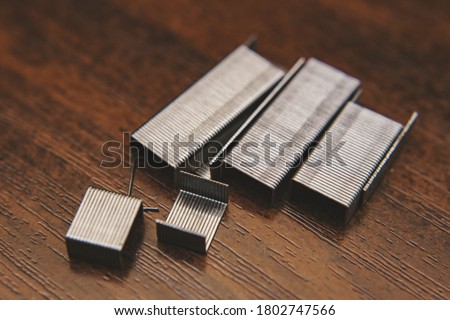metal staples on wooden background Photo stock © 