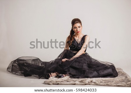 Woman in Dress Sitting On Floor