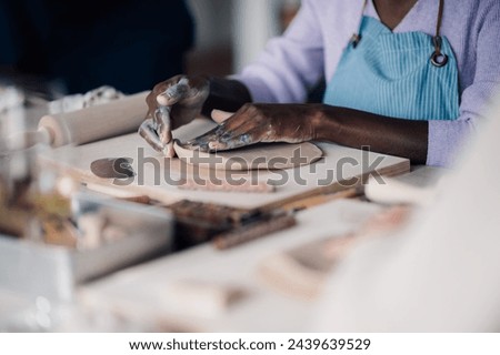 Similar – Image, Stock Photo Crop craftswoman making ceramic cup in workshop