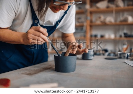 Similar – Image, Stock Photo Crop craftswoman making ceramic cup in workshop