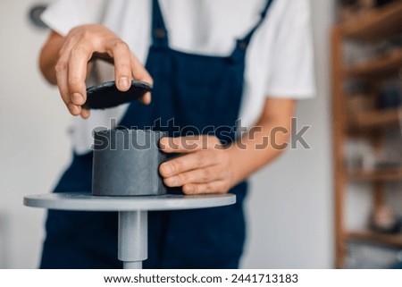 Similar – Image, Stock Photo Unrecognizable female ceramist making clay bowl in studio