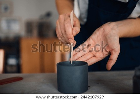 Similar – Image, Stock Photo Ceramist hands make a plate of clay