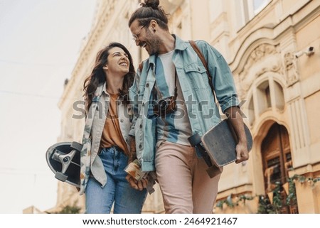 Similar – Image, Stock Photo young affectionate couple in the street