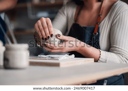 Image, Stock Photo Close-up of craftswoman working on her pottery in workshop