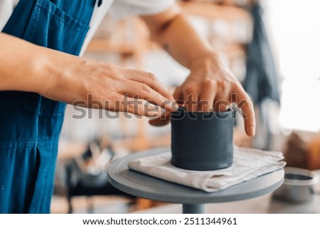 Similar – Image, Stock Photo Unrecognizable female ceramist making clay bowl in studio