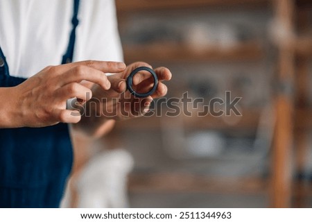 Similar – Image, Stock Photo Unrecognizable female ceramist making clay bowl in studio