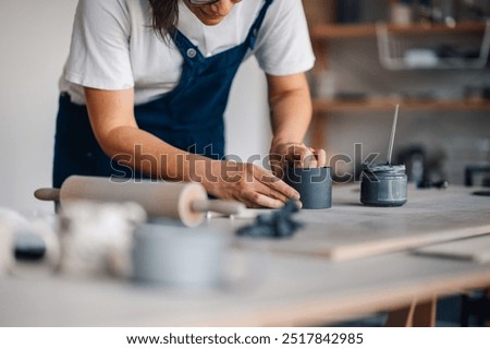 Similar – Image, Stock Photo Unrecognizable female ceramist making clay bowl in studio