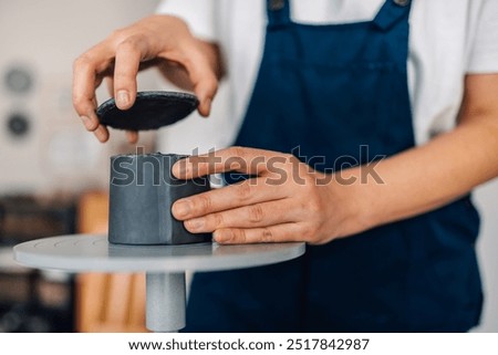 Similar – Image, Stock Photo Unrecognizable female ceramist making clay bowl in studio