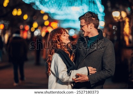 Similar – Image, Stock Photo young affectionate couple in the street