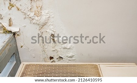 Damage caused by water leakage on a wall and ceiling at condominium. Soft focus. Stok fotoğraf © 