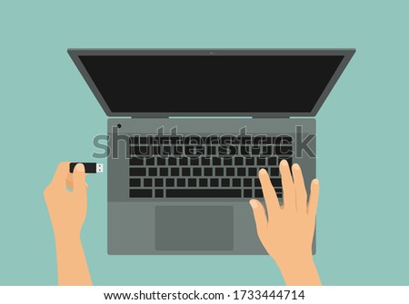Flat design illustration of gray laptop and hand connecting flash drive to USB - vector