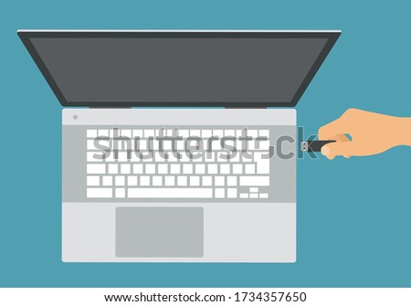 Flat design illustration of silver laptop with white keyboard and hand connecting flash drive to USB - vector