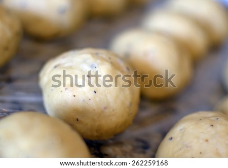 Bread dough roll balls in pan to raise