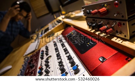 Similar – Image, Stock Photo Professional Recording Studio. Interface of equipment for sound processing. Fader. Different modes of audio console. Working on song or voice