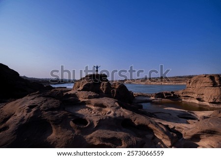 Similar – Image, Stock Photo Silhouette of traveler standing on top of mountain