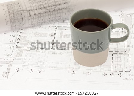 Architectural cad drawing with coffee cup
