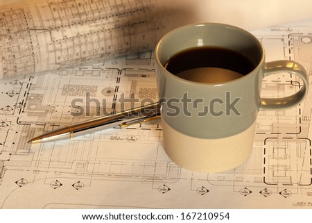 Architectural work with cad drawing and coffee cup