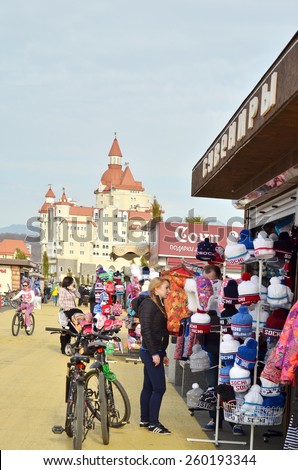 SOCHI, RUSSIA - FEBRUARY 7, 2015:Tourist buying souvenirs against hotel \