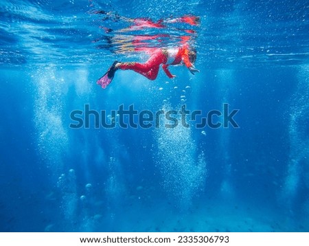 Similar – Image, Stock Photo Diver surrounded by bubbles jumping in water