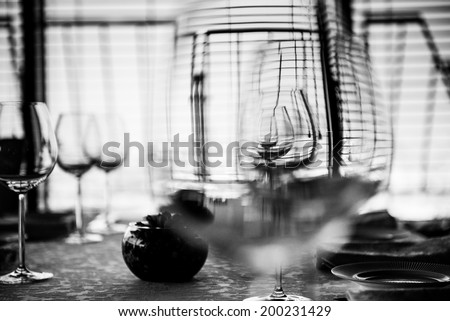 Table in restaurant served for lunch. Black and white abstract photo