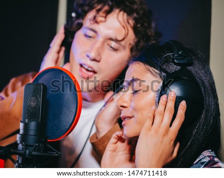 Similar – Image, Stock Photo Couple recording song at home