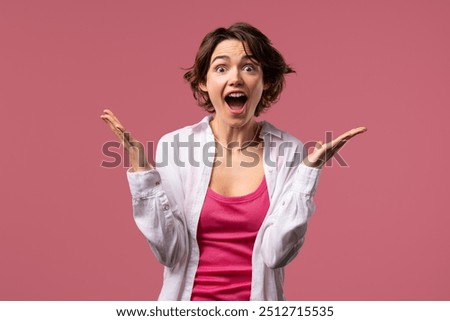 Surprised woman, she expresses WOW, cant believe. Impressed lady trying to get attention. Concept of sales, profitable offer. Excited romantic girl on pink background. High quality