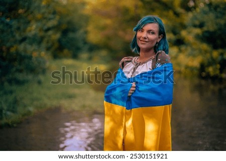 Similar – Foto Bild Lächelnde ukrainische Frau mit Nationalflagge auf Himmel Hintergrund. Porträt der jungen Dame in blauer Stickerei vyshyvanka. Kopieren Raum. Ukraine, Unabhängigkeit, Freiheit, patriotisches Symbol, Sieg im Krieg.