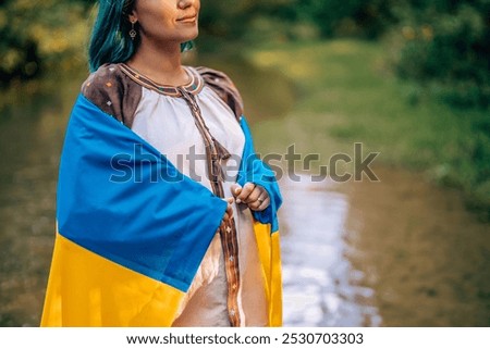 Similar – Image, Stock Photo Happy free ukrainian woman with national flag on dramatic sky background. Portrait of lady in blue embroidery vyshyvanka shirt. Ukraine, independence, patriot symbol