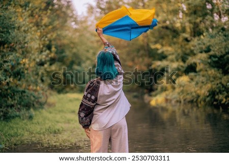 Similar – Foto Bild Lächelnde ukrainische Frau mit Nationalflagge auf Himmel Hintergrund. Porträt der jungen Dame in blauer Stickerei vyshyvanka. Kopieren Raum. Ukraine, Unabhängigkeit, Freiheit, patriotisches Symbol, Sieg im Krieg.