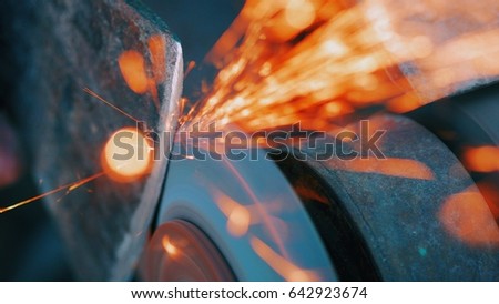 Similar – Image, Stock Photo Worker sharpening axe with electric grinder