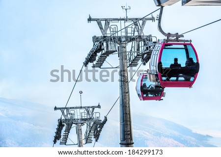 Cable car with passengers arriving at destination