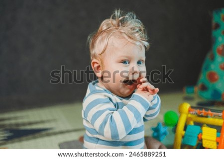 Image, Stock Photo Caucasian blonde baby seven months old lying on bed at home. Kid wearing cute clothing yellow color