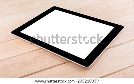 Digital tablet computer with isolated screen on old wood.