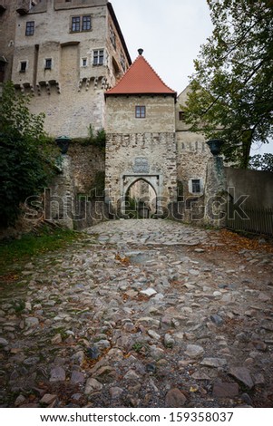 Paved road to the gate of mediaeval castle